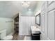 Bathroom with tiled flooring, chandelier and vanity sink at 27 Ellen Cir, Clayton, NC 27527
