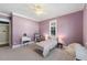 Comfortable bedroom with carpet, white trim and a cozy bed at 27 Ellen Cir, Clayton, NC 27527