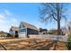Beautiful blue house with white picket fence and large yard under a clear blue sky at 27 Ellen Cir, Clayton, NC 27527