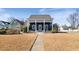 Charming home featuring blue siding, white trim, and a covered porch with a small garden in the front yard at 27 Ellen Cir, Clayton, NC 27527