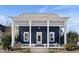 Charming home featuring blue siding, white trim, a covered porch with a small garden in the front yard at 27 Ellen Cir, Clayton, NC 27527