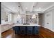 Spacious kitchen with a gas cooktop, a farmhouse sink, and classic white cabinetry at 27 Ellen Cir, Clayton, NC 27527