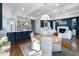 Spacious living and dining area with an open floor plan, a kitchen with a bar and hardwood floors at 27 Ellen Cir, Clayton, NC 27527