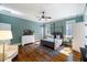 This spacious main bedroom features hardwood floors, a canopy bed, and ensuite bathroom access at 27 Ellen Cir, Clayton, NC 27527