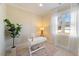 Bright office space with natural light, white desk, and view from the large window at 27 Ellen Cir, Clayton, NC 27527