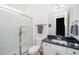 Contemporary bathroom featuring a glass shower and modern vanity with granite countertop at 276 Bevis Marks Dr, Fuquay Varina, NC 27526
