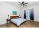 Calm bedroom with wood accents, ceiling fan, and blue decor elements at 276 Bevis Marks Dr, Fuquay Varina, NC 27526