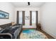 Bright bedroom with a daybed, light wood floors, and a pair of windows for natural light at 276 Bevis Marks Dr, Fuquay Varina, NC 27526