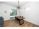 Bright dining area with modern lighting and access to a large sliding glass door at 276 Bevis Marks Dr, Fuquay Varina, NC 27526