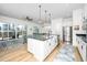 Open concept kitchen with island and modern appliances, flowing into a comfortable living space at 276 Bevis Marks Dr, Fuquay Varina, NC 27526