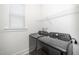 Convenient laundry area featuring modern washer and dryer with ample shelving at 276 Bevis Marks Dr, Fuquay Varina, NC 27526
