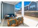 Relaxing screened porch features seating, blue accents, and an outdoor view at 276 Bevis Marks Dr, Fuquay Varina, NC 27526
