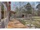 A covered porch and an outdoor shed in a fenced backyard at 279 Box Turtle Trl, Chapel Hill, NC 27516