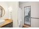 Bathroom with modern fixtures, white walls, window and dark vanity at 279 Box Turtle Trl, Chapel Hill, NC 27516