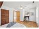 Cozy bedroom has hardwood floors, a ceiling fan, and a quaint built-in vanity at 279 Box Turtle Trl, Chapel Hill, NC 27516
