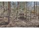 Backyard featuring a secure chicken coop within a fenced enclosure at 279 Box Turtle Trl, Chapel Hill, NC 27516