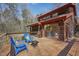 Wood deck area with an outdoor firepit and wooded views in the background at 279 Box Turtle Trl, Chapel Hill, NC 27516