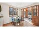 Cozy dining area with a table and chairs near large windows and access to the patio at 279 Box Turtle Trl, Chapel Hill, NC 27516