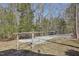 Gravel driveway leading to the house and a wooded property at 279 Box Turtle Trl, Chapel Hill, NC 27516