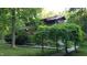 Charming exterior of the home featuring well-maintained lawn and privacy landscaping at 279 Box Turtle Trl, Chapel Hill, NC 27516
