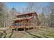 Charming cabin-style home featuring a spacious wooden deck and natural wooded surroundings at 279 Box Turtle Trl, Chapel Hill, NC 27516
