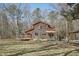 Rustic home showing the spacious yard and multiple outdoor living spaces at 279 Box Turtle Trl, Chapel Hill, NC 27516