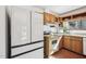 Charming kitchen showcases wood cabinetry, bright white countertops and appliances at 279 Box Turtle Trl, Chapel Hill, NC 27516