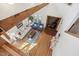 Open-concept living room with vaulted ceilings, wood beams, and a brick fireplace, viewed from above at 279 Box Turtle Trl, Chapel Hill, NC 27516