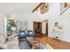 Bright living room with hardwood floors, a fireplace, and comfortable seating at 279 Box Turtle Trl, Chapel Hill, NC 27516