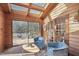 Relaxing sunroom with comfortable seating and access to the deck at 279 Box Turtle Trl, Chapel Hill, NC 27516