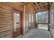 Spacious screened porch with wood floors and view of the surrounding woodlands at 279 Box Turtle Trl, Chapel Hill, NC 27516
