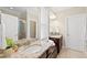 Bathroom features dual sink vanity with granite counters, decorative mirror and glass enclosed shower at 2851 Wilkes Lake Dr, Fuquay Varina, NC 27526