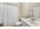 Bright bathroom with white cabinets and shower with curtain at 2851 Wilkes Lake Dr, Fuquay Varina, NC 27526