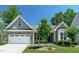 Charming single-story home with a brick facade, well-manicured lawn, and an attached two-car garage at 2851 Wilkes Lake Dr, Fuquay Varina, NC 27526