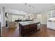 Spacious open kitchen features granite countertops, pendant lights and stainless appliances at 2851 Wilkes Lake Dr, Fuquay Varina, NC 27526