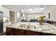Open kitchen/living area featuring a large island with seating, stainless appliances, and granite counters at 2851 Wilkes Lake Dr, Fuquay Varina, NC 27526