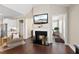 Open-concept living space with fireplace, a comfortable chair and hardwood floors at 2851 Wilkes Lake Dr, Fuquay Varina, NC 27526