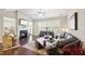 Cozy living room with a fireplace, hardwood floors, and comfortable seating arrangements at 2851 Wilkes Lake Dr, Fuquay Varina, NC 27526