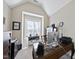 Home office featuring a vaulted ceiling and large window providing plenty of natural light at 2851 Wilkes Lake Dr, Fuquay Varina, NC 27526