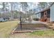 Backyard with a raised garden, shed and patio, perfect for outdoor enjoyment and gardening at 290 Silver Creek Dr, Clayton, NC 27520