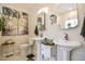 Bright bathroom featuring dual pedestal sinks, decorative art, and updated fixtures at 290 Silver Creek Dr, Clayton, NC 27520