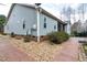 Home exterior with walkway, gravel, and screened-in porch at 290 Silver Creek Dr, Clayton, NC 27520