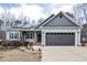 Charming single-Gathering home featuring a two-car garage, solar panels, and professionally landscaped yard at 290 Silver Creek Dr, Clayton, NC 27520