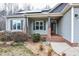 Inviting porch area featuring stylish shutters, professionally landscaped yard, and a welcoming entrance at 290 Silver Creek Dr, Clayton, NC 27520