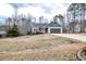 Charming home with a well-maintained lawn, two-car garage, and solar panels at 290 Silver Creek Dr, Clayton, NC 27520