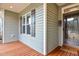 Inviting porch area featuring stylish shutters, and a welcoming entrance at 290 Silver Creek Dr, Clayton, NC 27520