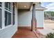 Inviting porch area featuring decorative pillars, and a welcoming entrance at 290 Silver Creek Dr, Clayton, NC 27520