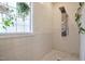 Walk-in shower with a large shower head and tiled walls at 290 Silver Creek Dr, Clayton, NC 27520