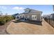 Spacious backyard with a patio, lush lawn, and privacy fencing, perfect for outdoor entertaining at 2907 Jakes View Pt, Fuquay Varina, NC 27526