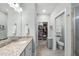 Bathroom featuring a single sink with granite countertop and vanity with an adjacent toilet and walk in closet at 2907 Jakes View Pt, Fuquay Varina, NC 27526